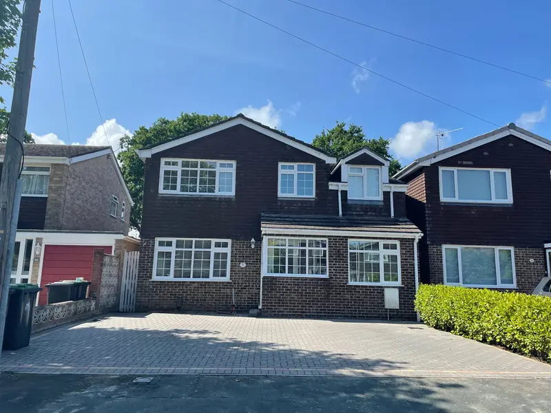 A house front with clean white windows