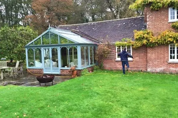 Cleaning the glass and frames of a conservatory